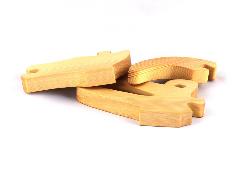 A 10-inch long wooden alligator puzzle for younger kids handmade and smoothly finished. This simple puzzle has three pieces, easy-to-grasp, interlocking, chunky, freestanding pieces. It is made to order.