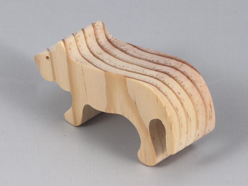 This is an unfinished wooden lioness cutout from solid wood using traditional woodworking techniques. Sanded smooth and ready to paint, stain, or customize. Freestanding design for small hands, toddlers, young children, crafters, collectors, and display. I take custom orders for any animal, quantity, and mix — including large ornament orders. Mix and match, request a different size, or send a drawing or pattern. Handmade by Odin's Toy Factory in Tallahassee, Florida, USA.