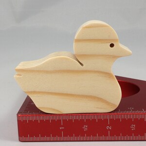 Handcrafted 2 inchwooden toy duck cutout made from 3/4-inch thick wood.