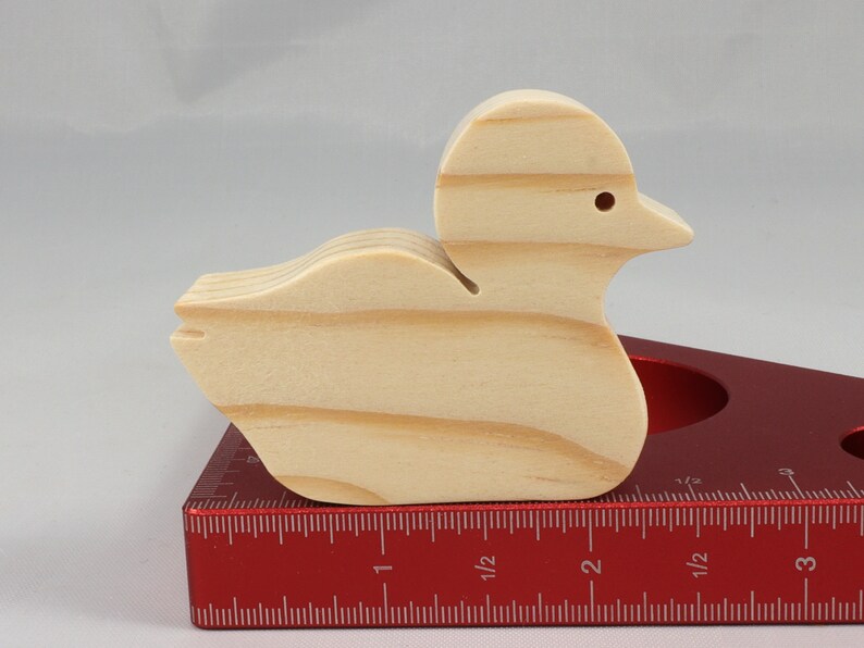 Handcrafted 2 inchwooden toy duck cutout made from 3/4-inch thick wood.
