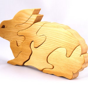 A wooden four piece puzzle in the shape of a rabbit. Perfect toddlers first puzzle.