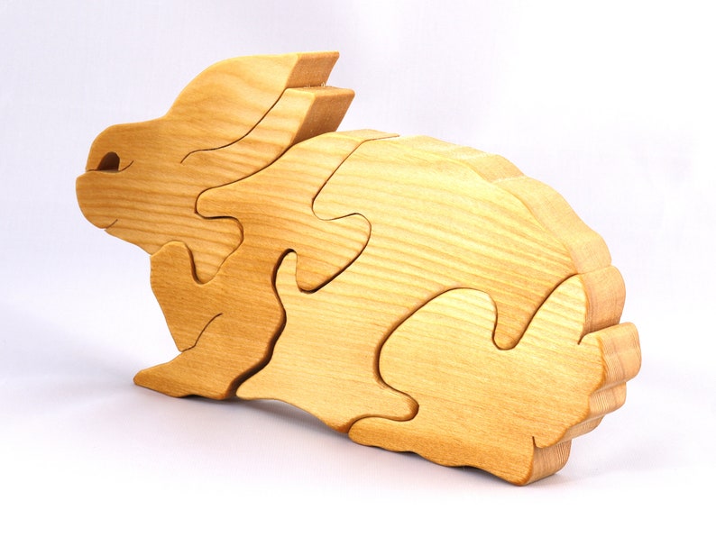 A wooden four piece puzzle in the shape of a rabbit. Perfect toddlers first puzzle.