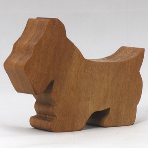 Handmade wooden Scottie dog toy cutout finished with mineral oil and beeswax blend. Freestanding stackable design from my Itty Bitty Animal Collection. Handcrafted in Tallahassee, Florida, USA from quality hardwood. Approximate size: length 2-1/2 inches, height 2 inches, width 3/4 inch. Each piece is unique with natural wood grain variations.