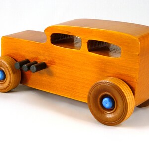 Handmade Wood Toy Car Hot Rod 1932 Sedan Finished With Amber Shellac And Trimmed With Metallic Saphire Blue And Black Acrylic Paint From My Hot Rod Collection