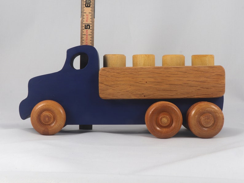 This handmade wooden Lorry truck is finished with navy blue acrylic paint and Amber Shellac. It is one of five towable trucks in this collection, available in many colors and unfinished. Custom Orders are welcome.