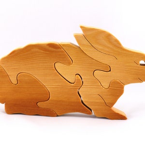 A wooden four piece puzzle in the shape of a rabbit. Perfect toddlers first puzzle.