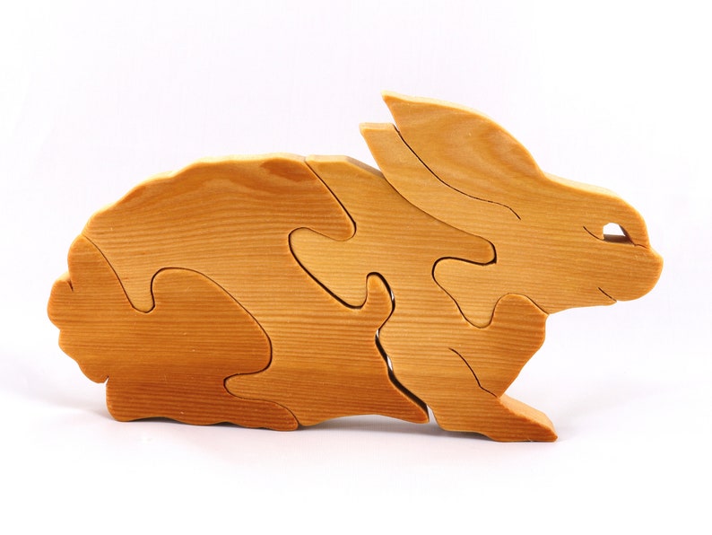 A wooden four piece puzzle in the shape of a rabbit. Perfect toddlers first puzzle.