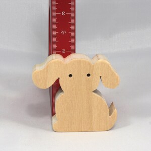 Handmade, stackable toy puppy dog cutout from the Itty Bitty Animal Collection. Unfinished and unpainted, crafted for creative play. Smoothly sanded and ready to be personalized with your favorite colors.