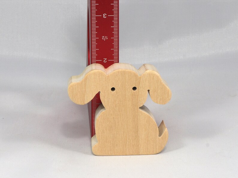 Handmade, stackable toy puppy dog cutout from the Itty Bitty Animal Collection. Unfinished and unpainted, crafted for creative play. Smoothly sanded and ready to be personalized with your favorite colors.