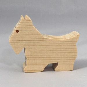 Handmade wood toy Scottie dog cutout unfinished unpainted paintable freestanding Itty Bitty Animal Collection. Approximate size 2.5 inches length by 2 inches height by 0.75 inches width. Handmade in Tallahassee Florida USA from natural wood offcuts.