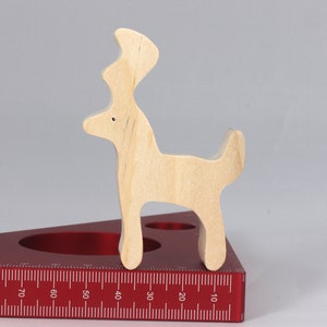 Handmade unfinished wooden deer toy figurine, part of the Itty Bitty Animal Collection, shown in natural light wood with visible grain, standing on a white background.