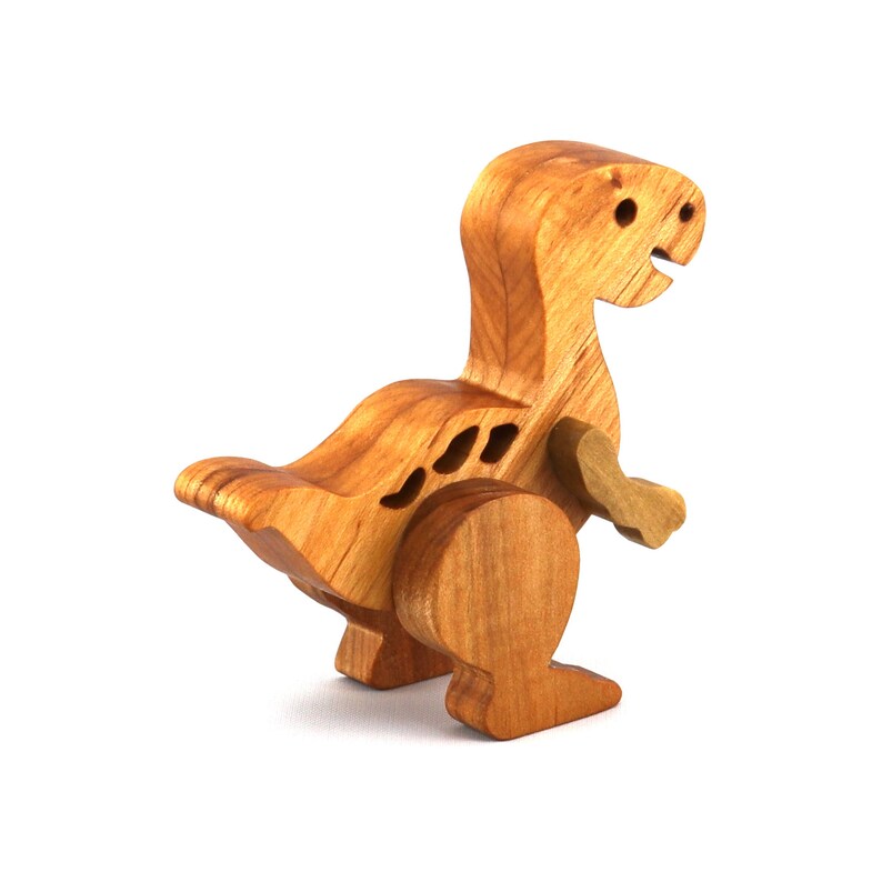 Handmade wooden baby dinosaur figurines, set of 3, made from hardwood with a natural oil and wax finish. Each baby dinosaur measures approximately 3 to 4 inches in height and length. Handmade in Tallahassee, Florida, USA at Odin's Toy Factory.