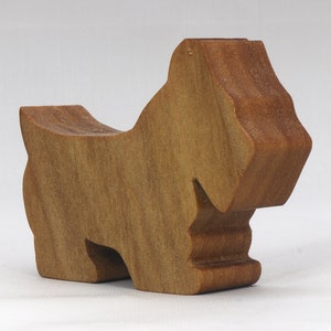 Handmade wooden Scottie dog toy cutout finished with mineral oil and beeswax blend. Freestanding stackable design from my Itty Bitty Animal Collection. Handcrafted in Tallahassee, Florida, USA from quality hardwood. Approximate size: length 2-1/2 inches, height 2 inches, width 3/4 inch. Each piece is unique with natural wood grain variations.