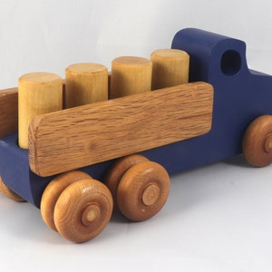 This handmade wooden Lorry truck is finished with navy blue acrylic paint and Amber Shellac. It is one of five towable trucks in this collection, available in many colors and unfinished. Custom Orders are welcome.