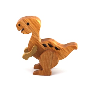 A wooden baby dinosaur figurine handmade and finished from select-grade hardwoods. It is an excellent toy for kids of any age. It is one of several dinosaurs in my collection.