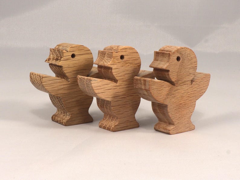 This is an unfinished wooden Singing Bird cutout from solid wood using traditional woodworking techniques. Sanded smooth and ready to paint, stain, or customize. Freestanding design for small hands, toddlers, young children, crafters, collectors, and display. I take custom orders for any animal, quantity, and mix — including large ornament orders. Mix and match, request a different size, or send a drawing or pattern. Handmade by Odin's Toy Factory in Tallahassee, Florida, USA.