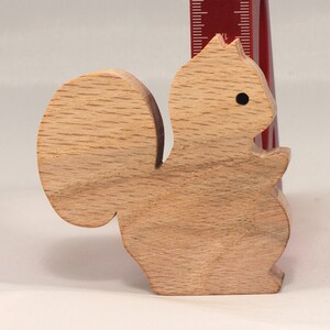 Handmade wood toy squirrel cutout is unfinished, unpainted, paintable, ready to paint, and freestanding from my Itty Bitty Animal Collection.
