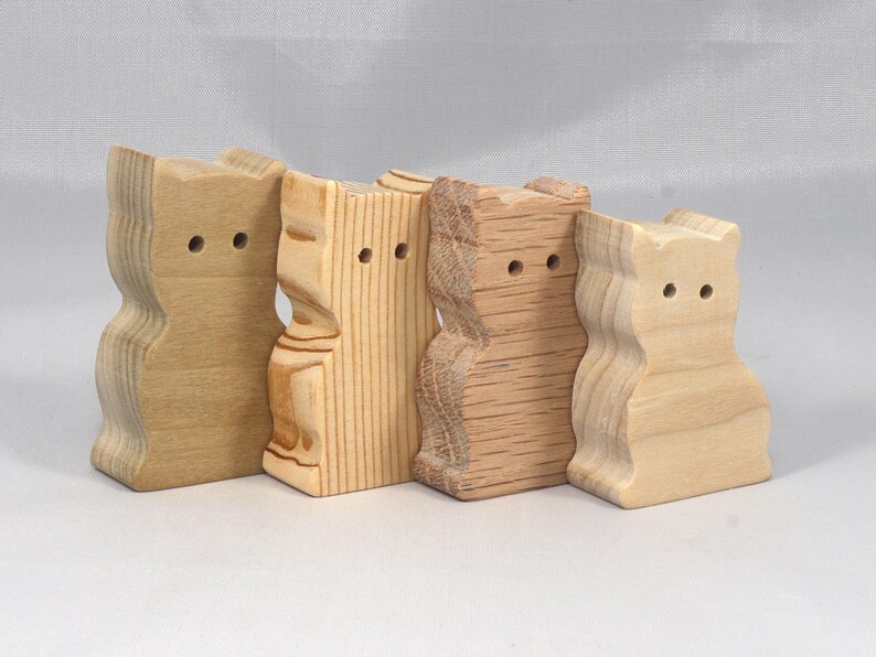 This is an unfinished wooden Sitting Cat cutout from solid wood using traditional woodworking techniques. Sanded smooth and ready to paint, stain, or customize. Freestanding design for small hands, toddlers, young children, crafters, collectors, and display. I take custom orders for any animal, quantity, and mix — including large ornament orders. Mix and match, request a different size, or send a drawing or pattern. Handmade by Odin's Toy Factory in Tallahassee, Florida, USA.