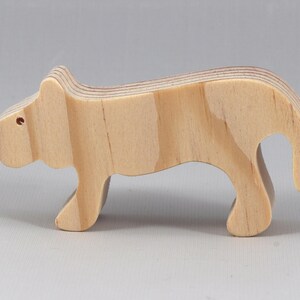 This is an unfinished wooden lioness cutout from solid wood using traditional woodworking techniques. Sanded smooth and ready to paint, stain, or customize. Freestanding design for small hands, toddlers, young children, crafters, collectors, and display. I take custom orders for any animal, quantity, and mix — including large ornament orders. Mix and match, request a different size, or send a drawing or pattern. Handmade by Odin's Toy Factory in Tallahassee, Florida, USA.