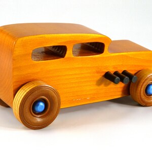 Handmade Wood Toy Car Hot Rod 1932 Sedan Finished With Amber Shellac And Trimmed With Metallic Saphire Blue And Black Acrylic Paint From My Hot Rod Collection