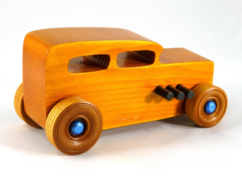 Handmade Wood Toy Car Hot Rod 1932 Sedan Finished With Amber Shellac And Trimmed With Metallic Saphire Blue And Black Acrylic Paint From My Hot Rod Collection