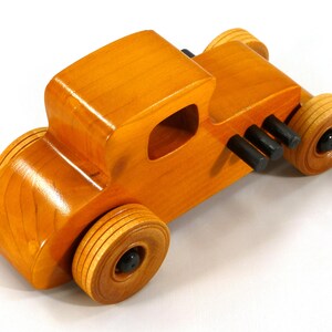 Handmade Wood Toy Car Hot Rod Based On The 1927 T-Coupe. It Has Been Hand-Finished With Multiple Coats Of Amber Shellac And Trimmed With Black Acrylic Paint.