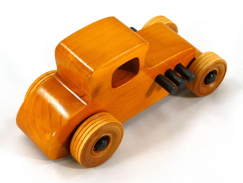 Handmade Wood Toy Car Hot Rod Based On The 1927 T-Coupe. It Has Been Hand-Finished With Multiple Coats Of Amber Shellac And Trimmed With Black Acrylic Paint.