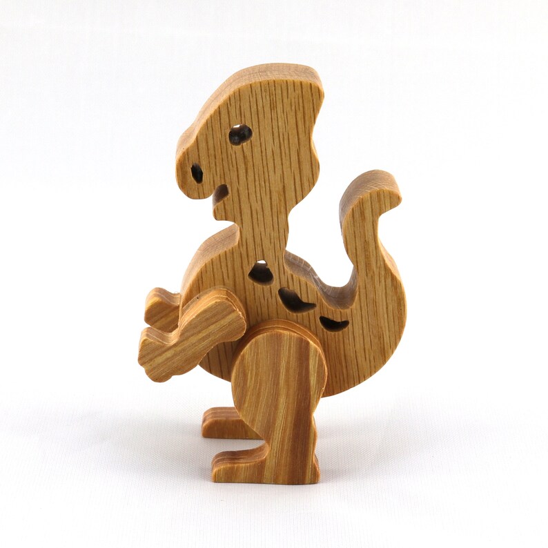 Wooden baby dinosaur figurine from My Buddies Dinos collection. Handmade with select grade hardwoods and finished with mineral oil and beeswax.