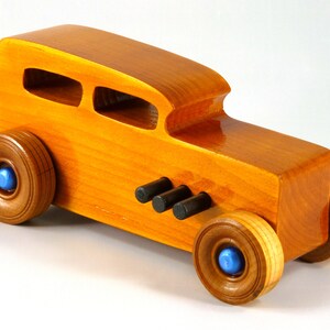 Handmade Wood Toy Car Hot Rod 1932 Sedan Finished With Amber Shellac And Trimmed With Metallic Saphire Blue And Black Acrylic Paint From My Hot Rod Collection
