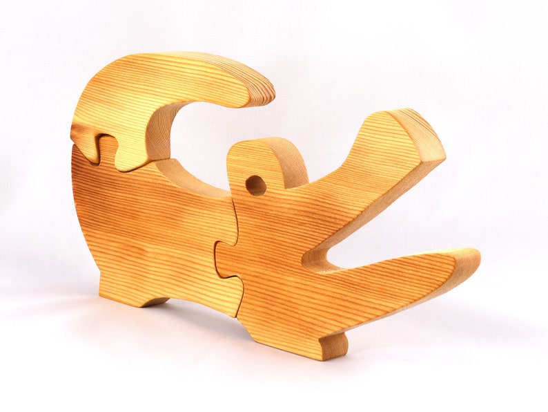 A 10-inch long wooden alligator puzzle for younger kids handmade and smoothly finished. This simple puzzle has three pieces, easy-to-grasp, interlocking, chunky, freestanding pieces. It is made to order.