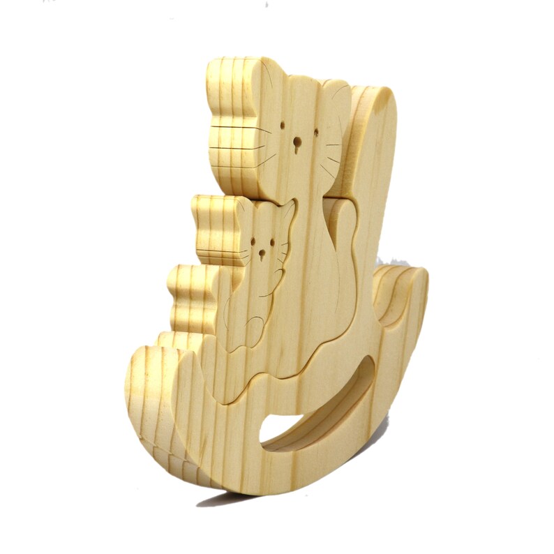 Handmade Wood Puzzle featuring Moma Cat and Baby Kitten in a Rocker, a simple three-part design crafted with traditional woodworking tools. Smoothly sanded and finished with a blend of mineral oil and beeswax for a lustrous touch.