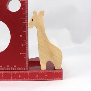 Handmade wooden giraffe cutout, unfinished, ready to paint, and freestanding. Perfect for a young child's imaginative play, stacking, or crafting.