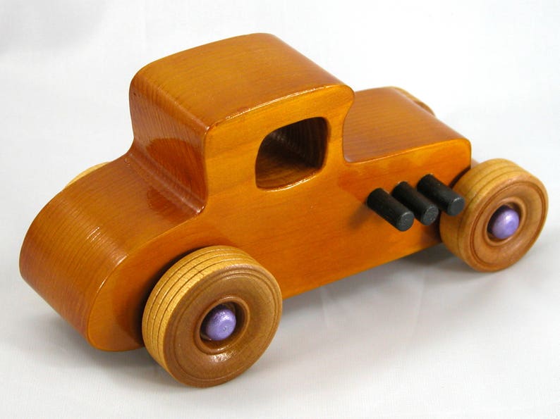 Handmade wooden toy car '27 T-Coupe, finished with amber shellac, metallic purple, and black acrylic paint. Made to order.