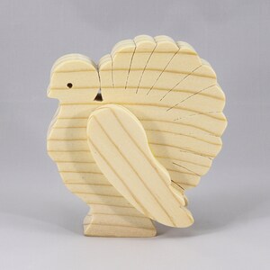 Handmade 3D layered freestanding wooden turkey figurine, unfinished and unpainted. Perfect for Thanksgiving decor, crafts, or as a toy.