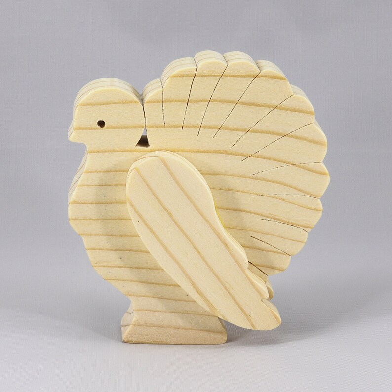 Handmade 3D layered freestanding wooden turkey figurine, unfinished and unpainted. Perfect for Thanksgiving decor, crafts, or as a toy.