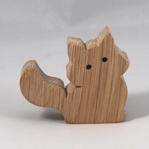 Handmade and unfinished, this stackable toy kitten cat cutout is ready to paint. This unpainted cutout is an excellent option for a fun DIY project or as a pretend toy for children. Available in several sizes, including custom orders.