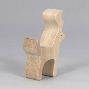 Handmade unfinished wooden deer toy figurine, part of the Itty Bitty Animal Collection, shown in natural light wood with visible grain, standing on a white background.
