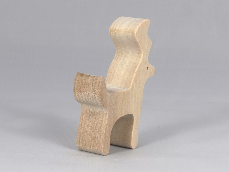 Handmade unfinished wooden deer toy figurine, part of the Itty Bitty Animal Collection, shown in natural light wood with visible grain, standing on a white background.