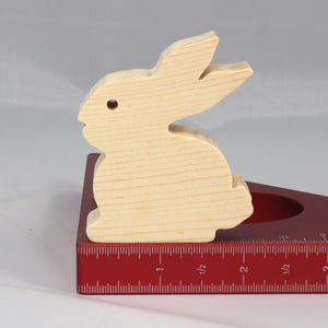 This is an unfinished wooden Rabbit cutout from solid wood using traditional woodworking techniques. Sanded smooth and ready to paint, stain, or customize. Freestanding design for small hands, toddlers, young children, crafters, collectors, and display. I take custom orders for any animal, quantity, and mix — including large ornament orders. Mix and match, request a different size, or send a drawing or pattern. Handmade by Odin's Toy Factory in Tallahassee, Florida, USA.