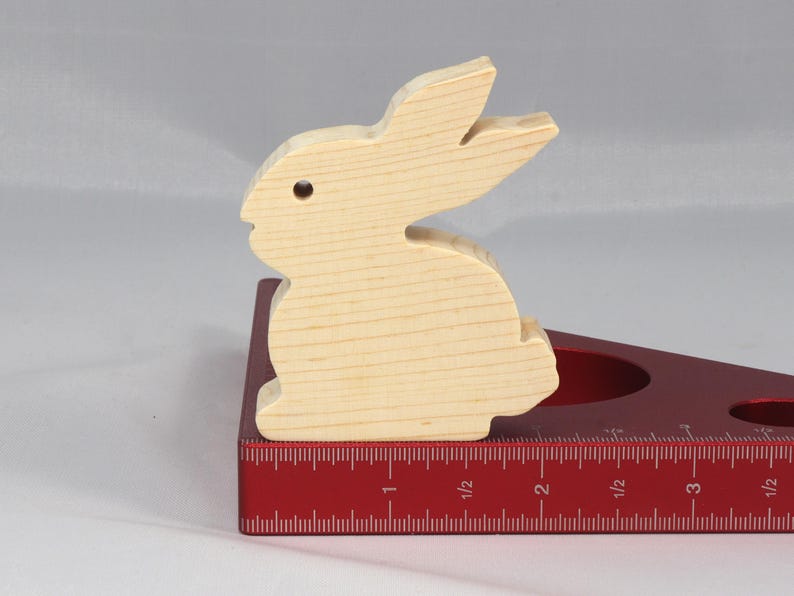 This is an unfinished wooden Rabbit cutout from solid wood using traditional woodworking techniques. Sanded smooth and ready to paint, stain, or customize. Freestanding design for small hands, toddlers, young children, crafters, collectors, and display. I take custom orders for any animal, quantity, and mix — including large ornament orders. Mix and match, request a different size, or send a drawing or pattern. Handmade by Odin's Toy Factory in Tallahassee, Florida, USA.