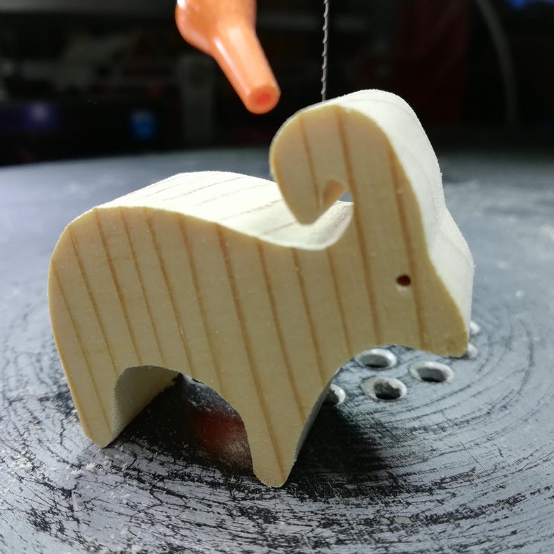 This is an unfinished wooden Ram cutout from solid wood using traditional woodworking techniques. Sanded smooth and ready to paint, stain, or customize. Freestanding design for small hands, toddlers, young children, crafters, collectors, and display. I take custom orders for any animal, quantity, and mix — including large ornament orders. Mix and match, request a different size, or send a drawing or pattern. Handmade by Odin's Toy Factory in Tallahassee, Florida, USA.