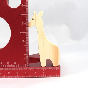 Handmade wooden giraffe cutout, unfinished, ready to paint, and freestanding. Perfect for a young child's imaginative play, stacking, or crafting.
