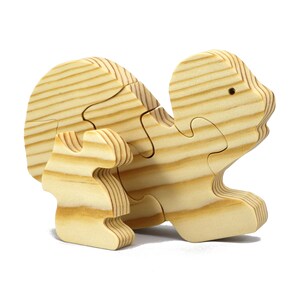 Handmade wooden turtle puzzle with 5 simple interlocking pieces. Freestanding 5-piece wooden puzzle. Approximate dimensions: 5 inches high by 7.25 inches long by 0.75 inches thick. Finished with mineral oil and beeswax blend. Handcrafted in Tallahassee, Florida, USA, using natural wood. Unique wood grain color and knot variations. Odin’s Toy Factory.