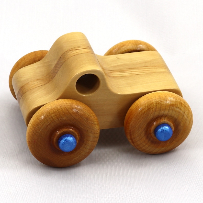 Handmade wooden toy pickup truck with a durable satin polyurethane finish and metallic sapphire blue trim from My Play Pal collection.