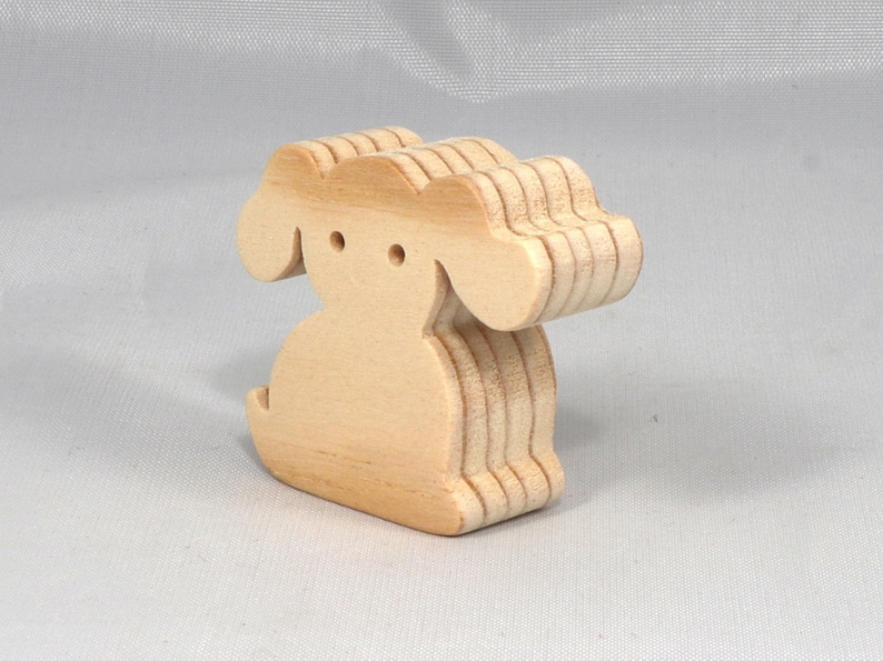Handmade, stackable toy puppy dog cutout from the Itty Bitty Animal Collection. Unfinished and unpainted, crafted for creative play. Smoothly sanded and ready to be personalized with your favorite colors.