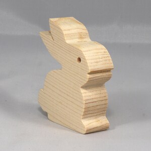 This is an unfinished wooden Rabbit cutout from solid wood using traditional woodworking techniques. Sanded smooth and ready to paint, stain, or customize. Freestanding design for small hands, toddlers, young children, crafters, collectors, and display. I take custom orders for any animal, quantity, and mix — including large ornament orders. Mix and match, request a different size, or send a drawing or pattern. Handmade by Odin's Toy Factory in Tallahassee, Florida, USA.