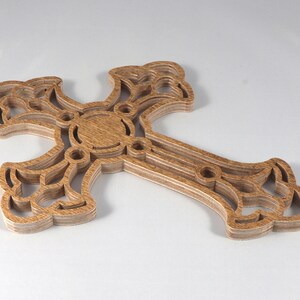 This beautiful handmade rustic fretwork cross is made from reclaimed hardwood flooring samples and adds a touch of rustic elegance to your home.