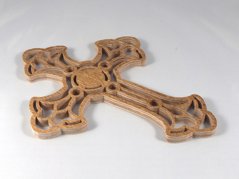 This beautiful handmade rustic fretwork cross is made from reclaimed hardwood flooring samples and adds a touch of rustic elegance to your home.