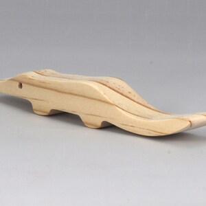 Handmade toy alligator cutout from the Itty Bitty Animal Collection. Crafted with traditional woodworking tools, this unfinished wood alligator is freestanding, smooth-sanded, and ready to paint. Perfect for stacking and imaginative play.