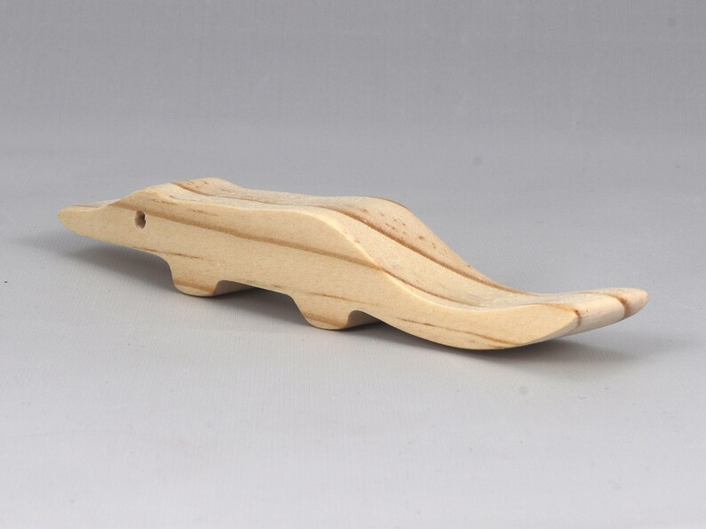 Handmade toy alligator cutout from the Itty Bitty Animal Collection. Crafted with traditional woodworking tools, this unfinished wood alligator is freestanding, smooth-sanded, and ready to paint. Perfect for stacking and imaginative play.